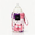 Chauffe-biberon de voyage USB avec housse chauffante à motifs chats roses et violets, bouton marche/arrêt et sangle, sur fond blanc